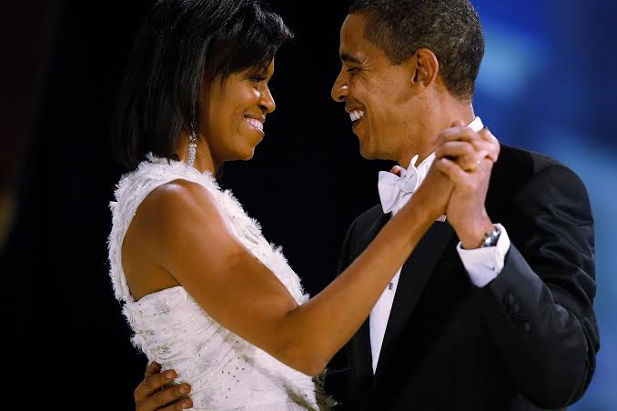 Obama dancing with Michelle, smiling