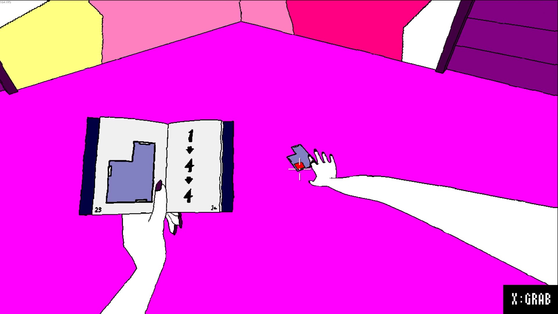 Here, I'm holding a manual in one hand. In the other, I'm reaching for an object on the floor with a comically long arm.